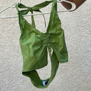 Tight green halter neck crop top